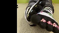 teen worships sexy feet and toes, licking and sucking on butts in fetish scene