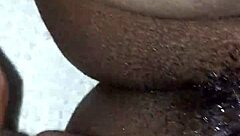 ebony babe plays with wet pussy using vibrator and huge black cock toy.