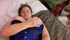 granny carmen feels intense pleasure from thrusting vibrator in lingerie, reaching orgasm.