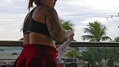 Exhibitionist flashing ass under skirt on balcony