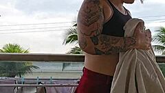 Exhibitionist flashing ass under skirt on balcony