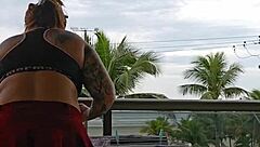 Exhibitionist flashing ass under skirt on balcony