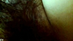 A young Asian teen fucks his friend's hairy wife at home in an amateur video.