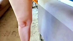 Mature woman spreads her huge pussy lips close-up