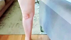 Mature woman spreads her huge pussy lips close-up