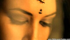 Beautiful brunette from Bollywood dances in a cute teasing way.