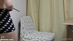 Mini Skirt Japanese Girl Sits on Chair in Apartment, Reading Porn Books While Fingering Her Cute Pussy Under Desk