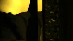 an exotic brunette lover from india dances seductively, teasing with her erotic striptease and undressing in a softcore display.