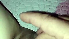 In a homemade video, an amateur pregnant milf experiences a quick slap in an intimate moment.