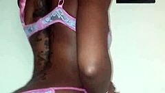 Lola performs a seductive ebony striptease dance, ripping clothes in petite solo undressing.