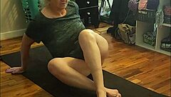 Hot milf stretches in early morning yoga session