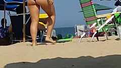 Hey, check this candid bikini slut at the beach 😏