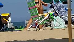 Hey, check this candid bikini slut at the beach 😏