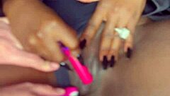 Sexy black model shoves vibrator deep in shaved pussy for white guy watching!