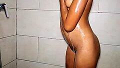 Sexy teen 18+ steps into the bathroom to prepare for an exciting group gathering with friends.