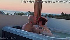 redhead couple starts kissing in jacuzzi then she sucks small cock underwater