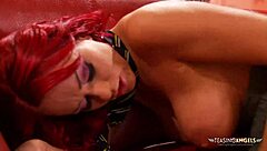 Busty redhead slut in uniform rides cock cowgirl style while moaning from shaved pussy licking on sofa.