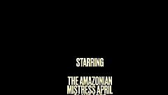 in this scene, the dominatrix mistress april straps on latex gear to dominate her bound ebony slave with strapon fucking and deepthroat sucking