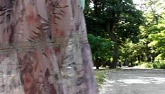 hairy mature woman strolls in a see-through dress, teasing with flashes of her body in public spots