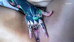 Hey, check out this close-up view of a curly, tattooed alternative girl doing a wedgie and spreading in a homemade clip