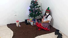 This mature student unwraps her Christmas gifts and enjoys masturbating with a dildo under spotlights in her uniform.