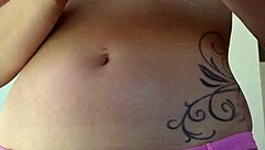 Rubbing suncream on tits during public sunbathing. Blonde housewife flashes petite body at the beach.