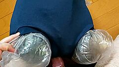 Woman masturbates by rubbing bloomers against electric massager.