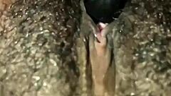 Man, this ebony babe plays with her hairy wet pussy in homemade solo until she orgasms hard.