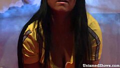 horny brunette stripper starts ripping clothes in a teasing striptease before masturbating wildly on the stage