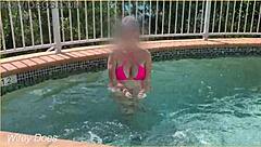 Hey, check out my wife flashing her big tits in the hotel pool during our daring public exhibitionist adventure.