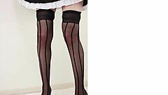 Japanese woman in stockings and heels crushes a hamburger under her feet in fetish food play