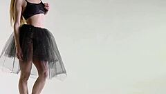 This sexy girl casually stretches in flexible poses, revealing her athletic body during a nude yoga workout