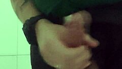 In the mall bathroom, the security guard casually takes a break to masturbate solo.