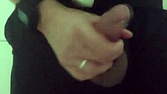 In the mall bathroom, the security guard casually takes a break to masturbate solo.