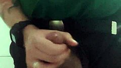 In the mall bathroom, the security guard casually takes a break to masturbate solo.