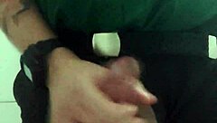 In the mall bathroom, the security guard casually takes a break to masturbate solo.