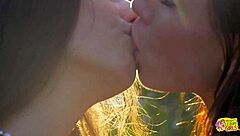Two lesbians run through outdoor field then kiss with big clit licking masturbation and passionate pussy sex on grass