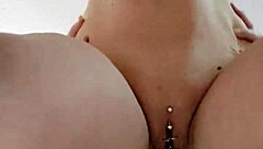 The amateur couple gets heated in the bedroom as he takes her pierced pussy from behind in intense doggystyle sex