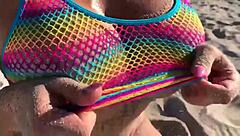 Do you want to see this beautiful blonde milf with big ass and tits on the beach?