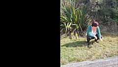 Narrative of trashy Kiwi milf pissing on roadside amid traffic in outdoor public scene