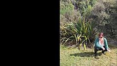 Narrative of trashy Kiwi milf pissing on roadside amid traffic in outdoor public scene