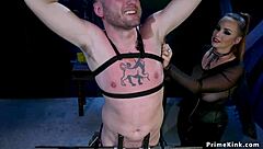 Dude With Cock In Metal Device Faces Femdom Strapon Domination And Rough Whipping