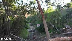 Alyssa Cole lifts her top to flash perky tits while walking through the crowded park with friends watching