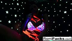 Romi starts off in the night club with a shiny disco ball nearby. Then she focuses on stuffing and toying her wet pussy solo.