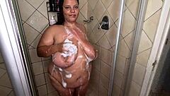 Oh wow, this big tits big ass bbw is teasing in a hot soapy shower! 🛁😍
