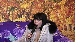 This milf slips into her down coat with fur hood and starts sucking that big dildo in all sorts of positions for homemade fetish fun