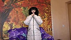 This milf slips into her down coat with fur hood and starts sucking that big dildo in all sorts of positions for homemade fetish fun