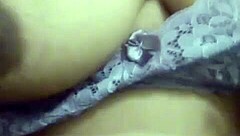 In a rural setting, the Indian milf from the village displayed her large chest during a video call.