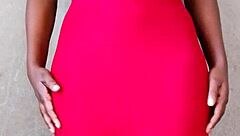 This sexy African lady teases by revealing her alluring tits