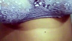 In a rural setting, the Indian milf from the village displayed her large chest during a video call.